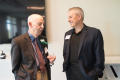 Photograph: [Ray Moseley talking with Man at A Century of Excellence Event]