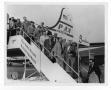 Photograph: [Photograph of Stan Kenton and Orchestra Boarding a Plane]