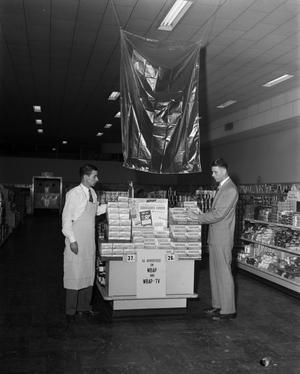 Primary view of [Two men with a store display, 2]