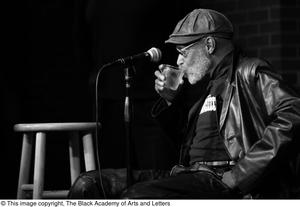 Primary view of [Photograph of Melvin Van Peebles taking a drink, 2]