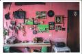 Photograph: [Wall decorated with items]