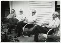 Photograph: [Four Jack Daniel's employees on porch]