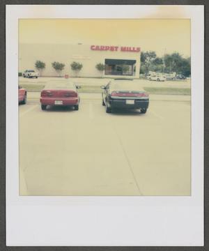 Primary view of [Two automobiles parked]