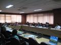 Photograph: [Attendees sit around conference table, UNT delegation's trip to Thai…