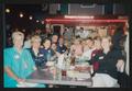 Photograph: [11 people seated around a restaurant table: Lone Star Ride 2003 even…