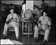Photograph: [Soldiers Seated Next to Cookie Jar]