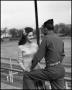 Photograph: [Woman talking with a soldier]