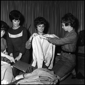 Primary view of [Alpha Delta Pi members pack clothing for the Foster Parents Plan, 1966]