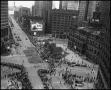 Photograph: [Aerial photograph of a parade marching downtown, 3]