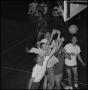 Photograph: [7 men jumping for a basketball]