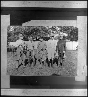 Primary view of [Group of hunters holding frogs]