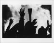 Photograph: [Eagle talon salute silhouettes at North Texas Homecoming bonfire, 19…