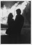 Photograph: [Couple silhouetted against North Texas Homecoming bonfire, c. 1980]